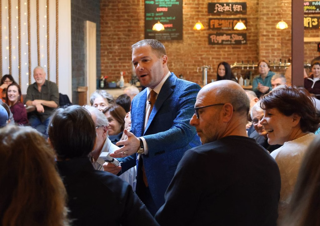 Michael works the crowd at an auction.